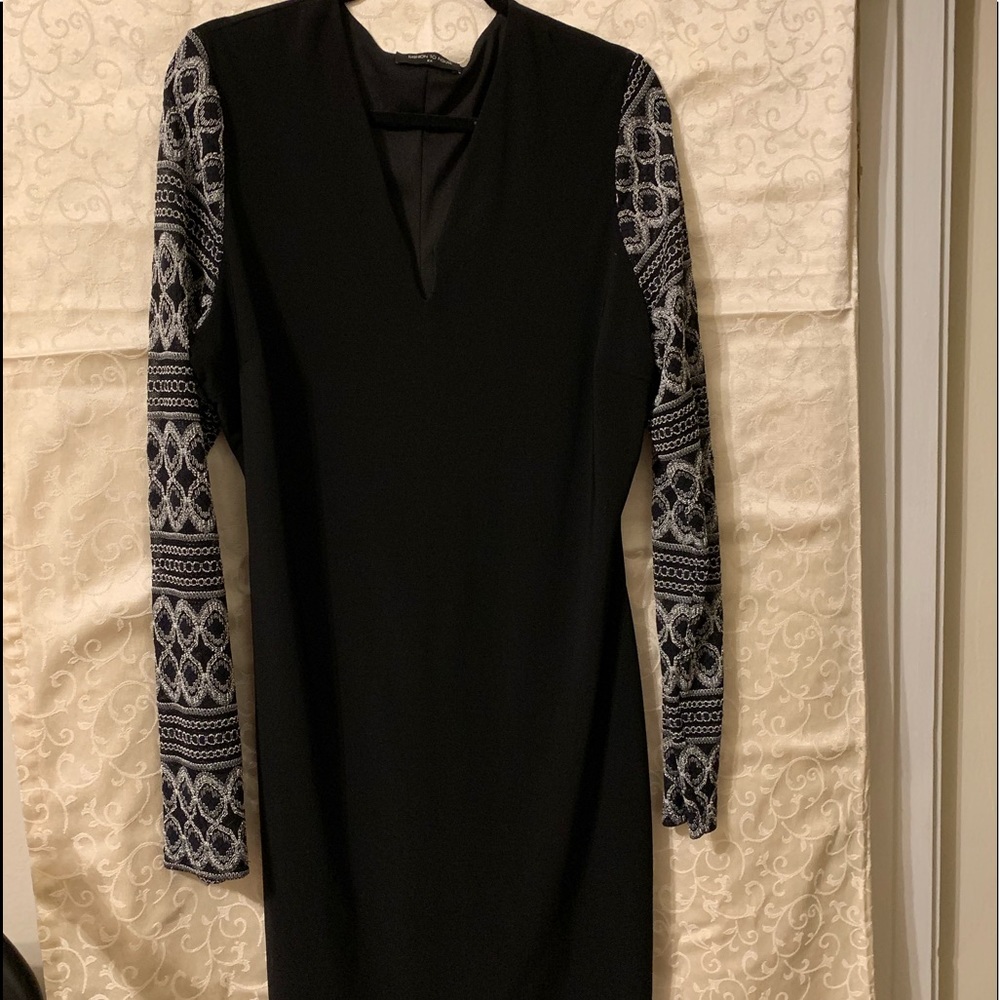 Long sleeve, knee length LBD(Little black dress).